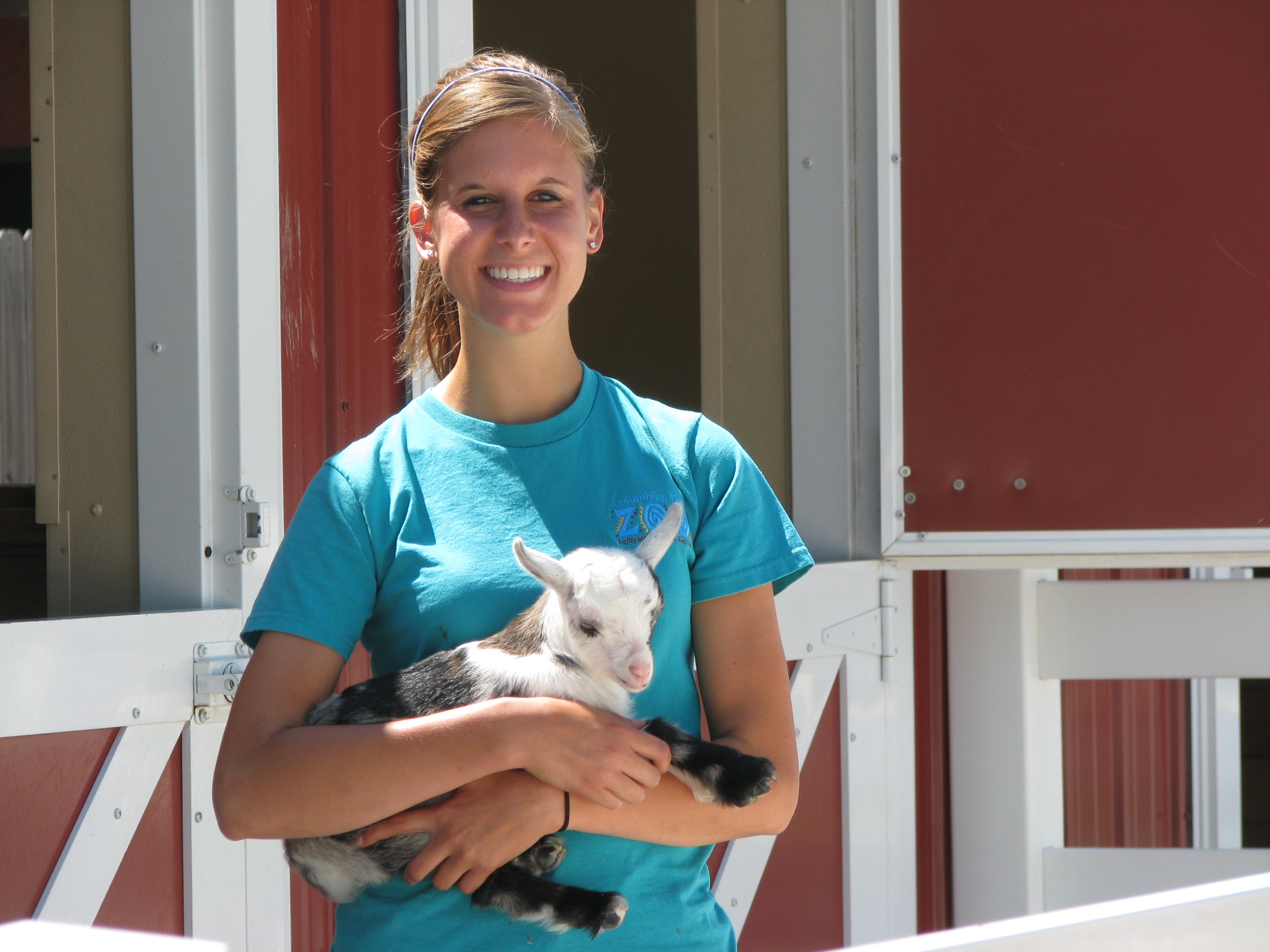 intern with baby goat.JPG